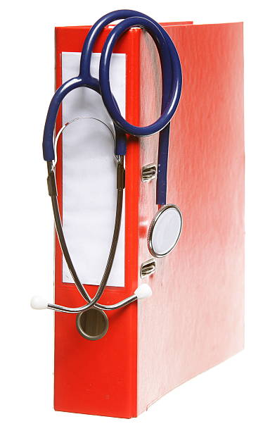istock Blue stethoscope and red binder isolated on white 178147269