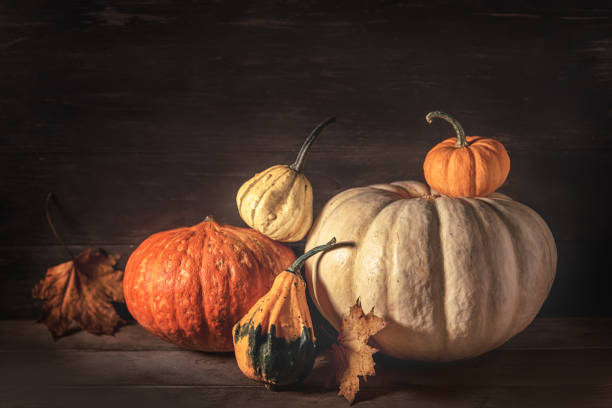 istock Autumn arrangement with pumpkins and maple leaves 1781474780