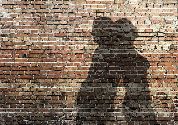 istock shadow of man and woman on wall 178147655