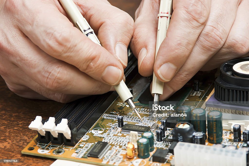 computer repair Repair of computers and electronic metering parameters Adult Stock Photo