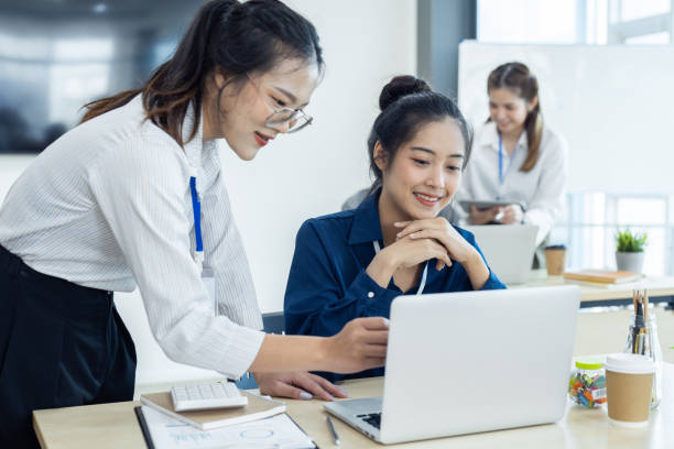 istock Employees discuss brainstorming planning business strategy together in the office 1781480093