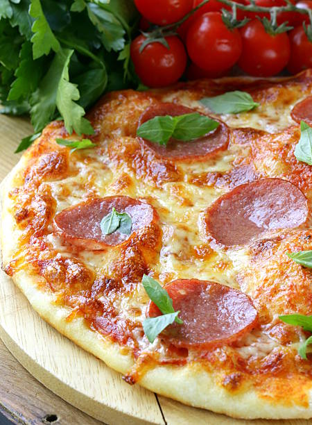 istock Pepperoni pizza with tomato sauce and herbs 178148140