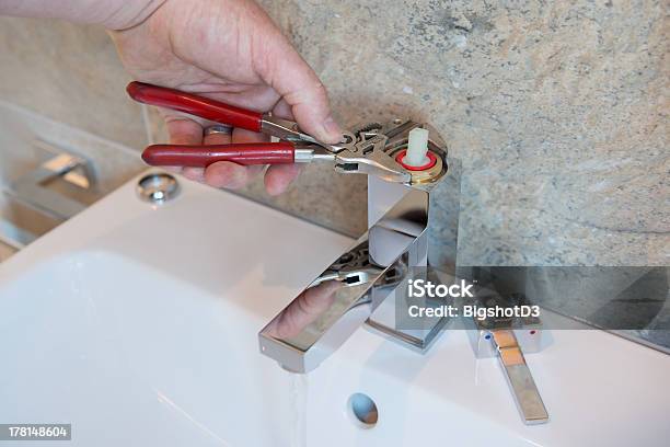 Plumber Stock Photo - Download Image Now - Faucet, Leaking, Bathroom Sink