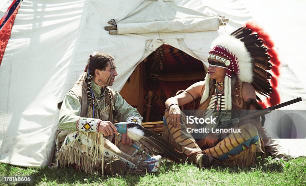 North American Indians Sit At A Wigwam Stock Photo - Download Image Now - Indigenous Peoples of the Americas, Leadership, Tomahawk Axe
