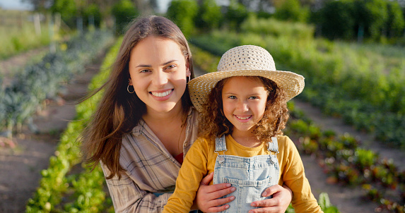 Agriculture, farming and farmer, woman and girl happy, fresh vegetable and organic growth. Mother and daughter in portrait, green sustainability and environment, nature and nutrition with harvest.