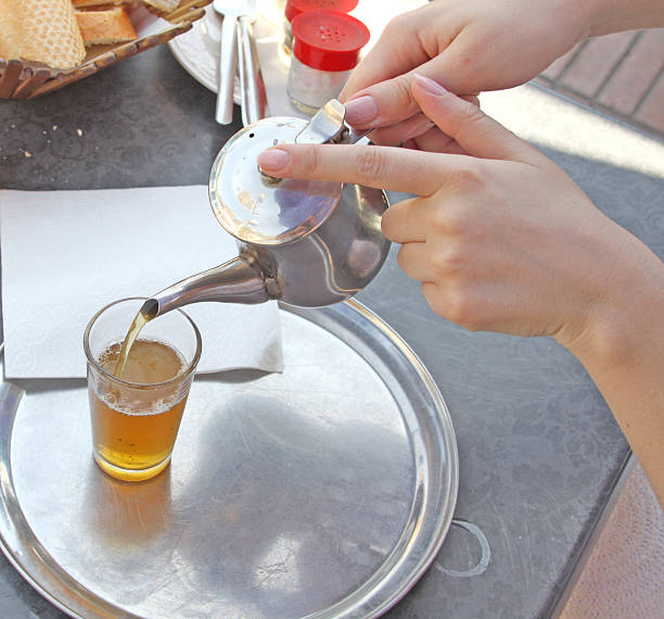 istock Kettle of moroccan mint tea and a glass 178149983