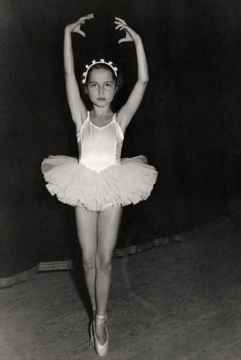 Little Girl Dancing on Stage in 1956. Sepia Toned.