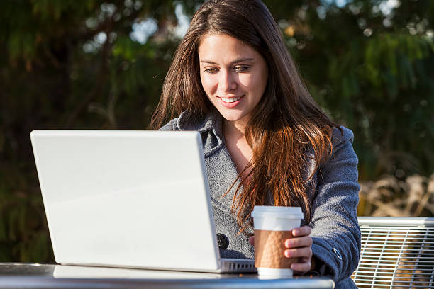 istock Young Woman Girl Using Laptop Drinking Coffee 178150902