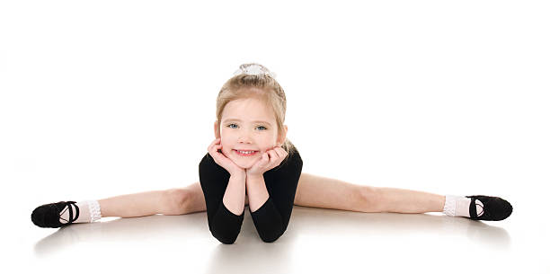 istock Gymnast cute little girl doing exercises isolated 178151424