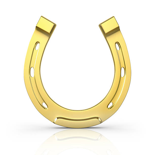 istock Single golden horseshoe standing upright on white 178151640