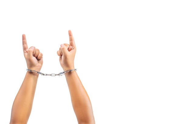istock Human hand in handcuff with a hand gesture of pointing something 1781517246