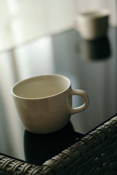 istock Image of two coffee cups on a glass table 1781529246