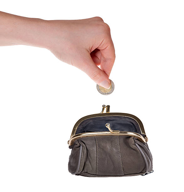 istock human hand put euro coin in purse on white 178152984