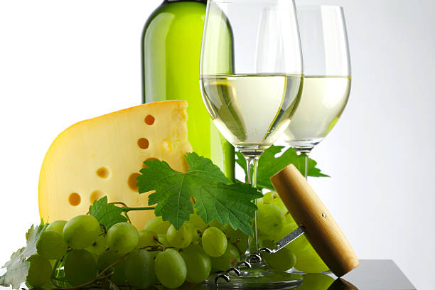 istock bottle with white wine, glass and grapes 178153218