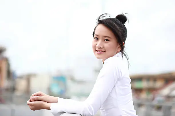 Vietnamese young girl in white traditional dress aodai (Áo Dài)