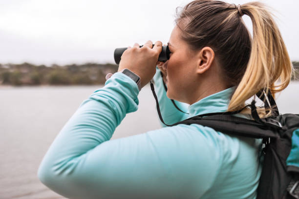 istock Hiker Scanning the Landscape with Binoculars 1781549328