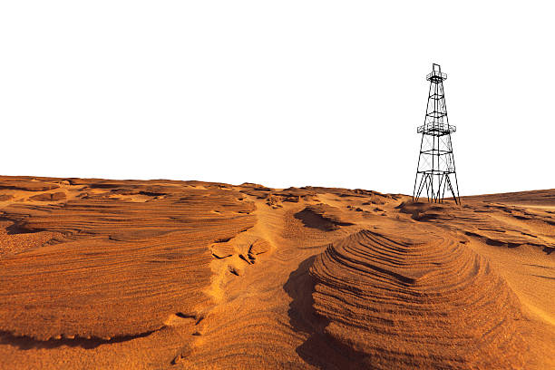 Sand dunes and isolated oil and gas rig tower close to a beach location