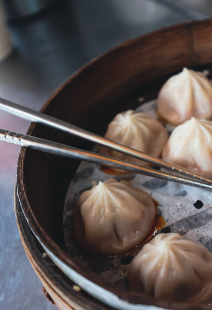 istock Fresh Dumplings with the Sticks in Traditional bamboo plate 1781556227