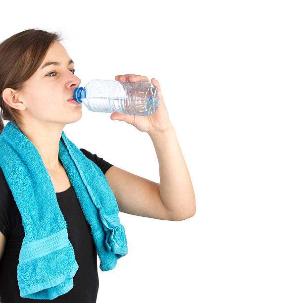 istock Woman in sportswear drinking water 178156026