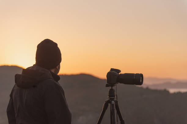 istock Photographer enjoying sunset or sunrise 1781561308