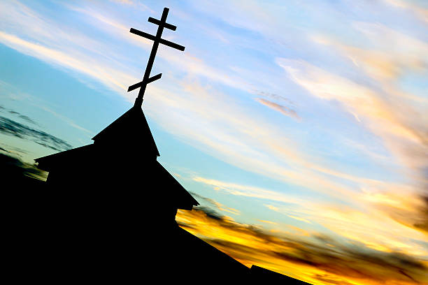The Church with the symbol of faith on the background scenery of heaven.