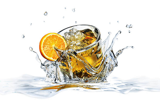 istock Cocktail glass, falling into clear water, forming a crown splash. 178157987