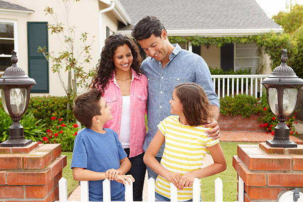 istock Hispanic family outside home 178159381