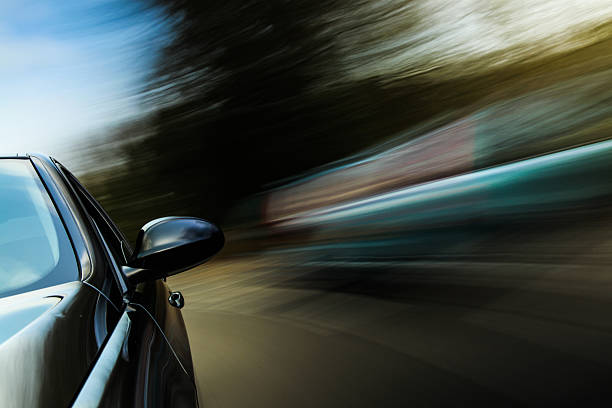 istock View down left side of black car taken at speed 178159566