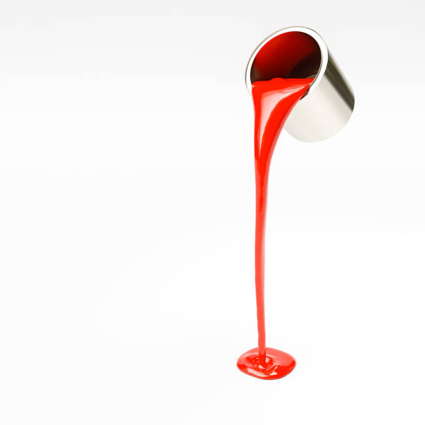 red paint poured from a can on a white background