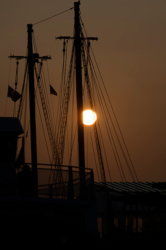 Boston Harbour near Long Wharf in the Financial District in Boston.  This is taken as the sun rises over yachts moored in the harbour.