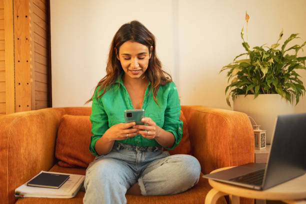istock Woman using mobile phone to check her banc account 1781607934