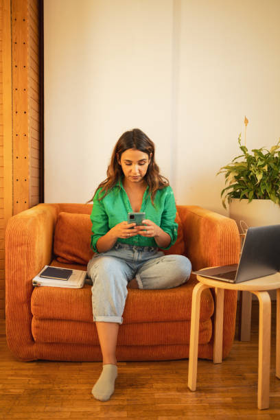istock Woman using mobile phone to connect to online banking 1781607989