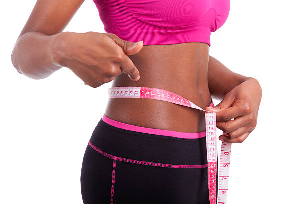African American Fitness woman showing her belly stock photo