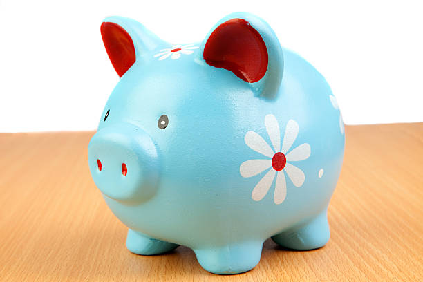 istock Blue piggy-bank on a wooden table 178162202