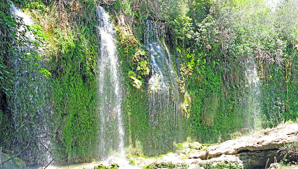 panorama of waterfall cascade in deep forest waterfall falling cascade in deep forest kursunlu waterfall stock pictures, royalty-free photos & images