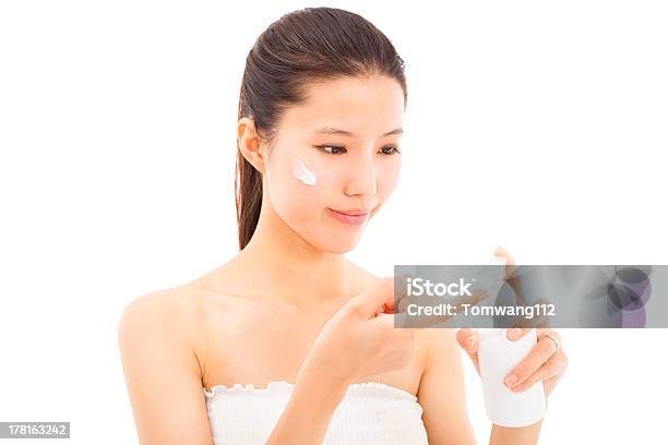 Beautiful Face Of Woman Applying Moisturize Cream Stock Photo - Download Image Now - Adult, Adults Only, Applying