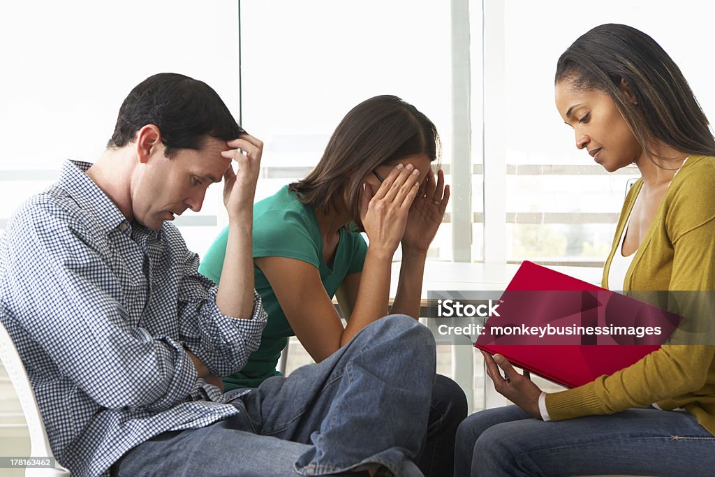 Couple Having Relationship Counselling Couple Having Relationship Counselling Wit Counsellor Having An Argument 20-29 Years Stock Photo