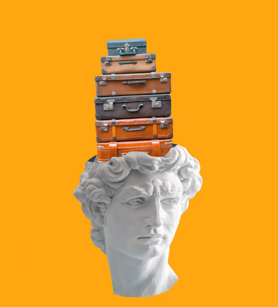 istock White plaster statue head with suitcases on yellow background. 1781636546