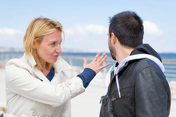 istock young woman slapping man at wharf 178163828