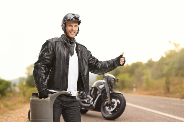 istock Biker holding a gas container and hitchhiking 1781647591