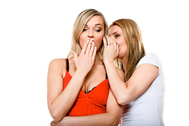 istock Gossiping friends, two women sharing a secret 178165570