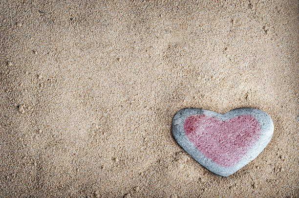 istock Tinted Heart Stone on Sand 178165988