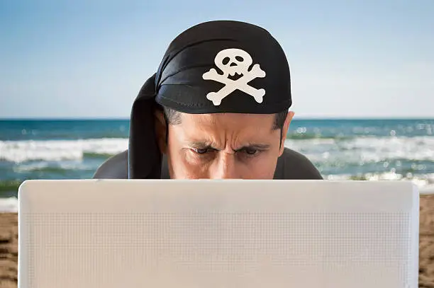 Photo of hacker confused on the beach
