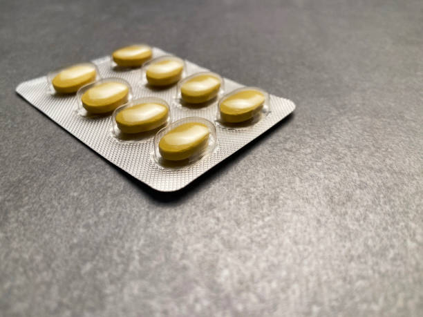 Medicine pill blister pack on gray background with copy space