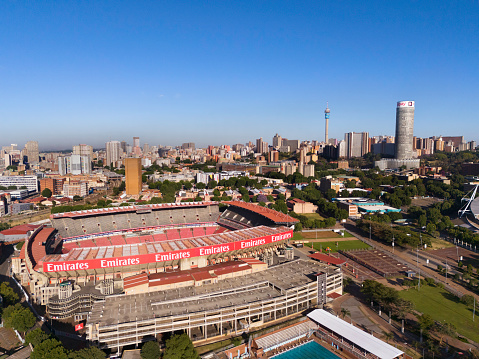 Johannesburg city with Ellis Park Stadium now called Emirates stadium, the prominent Ponte City apartments and Telkom Communications tower, seen in the distance.