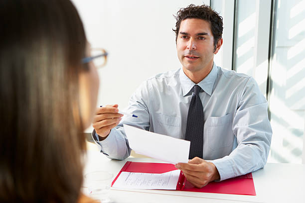 istock Businessman Interviewing Female Candidate For Job 178169066