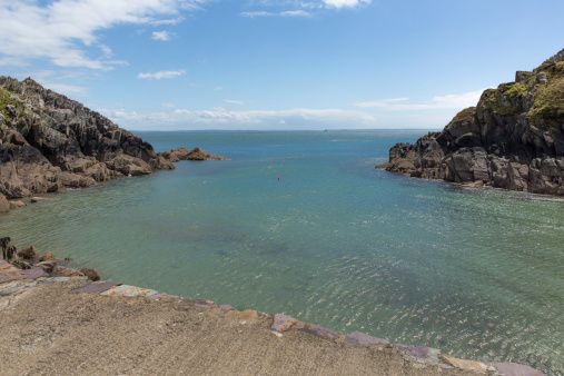 Porthclais port near St David's Pembrokeshire, West Wales.   Harbour built in 12th century within the St. David’s Peninsula Site of Special Scientific Interest and leads to St Brides Bay.  The Pembrokeshire Coast Path passes alongside the bay