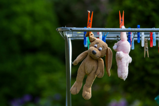 teddy bear hanging on a Clothesline
