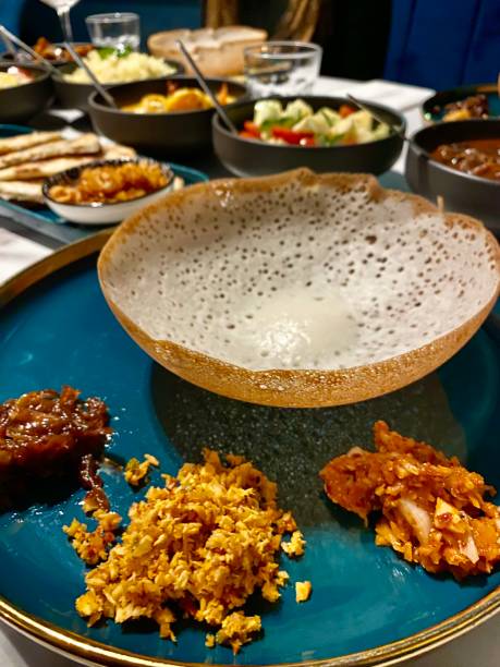 istock Delicious Sri Lankan Hopper Thin Savoury Pancake with Selection of Sambals on Serving Dinner Plate at Restaurant 1781699372