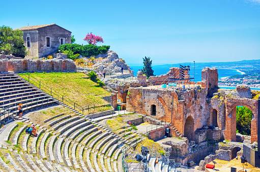 The Greco-Roman amphitheatre at Taormina with Mediterranean Sea in background, Sicily, Italy